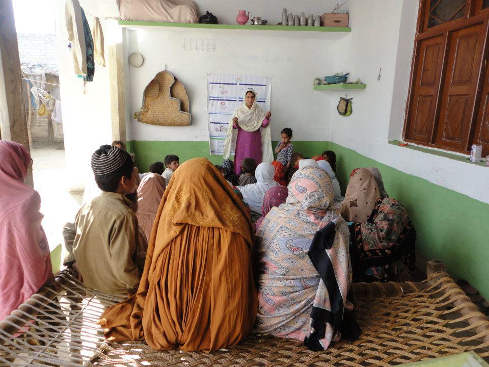 A female educator is doing in-home lessons