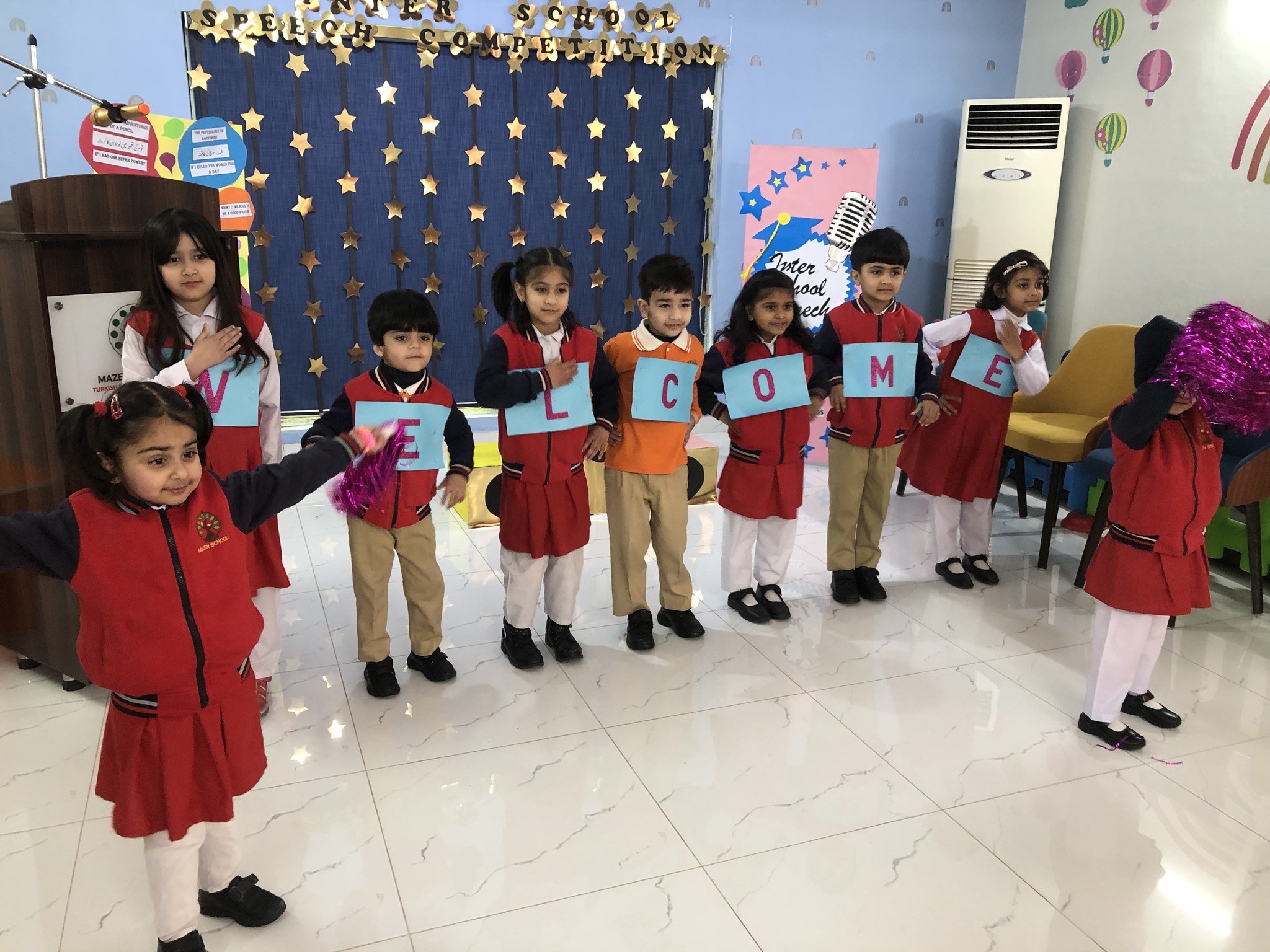 Beautiful children are greeting guests.
