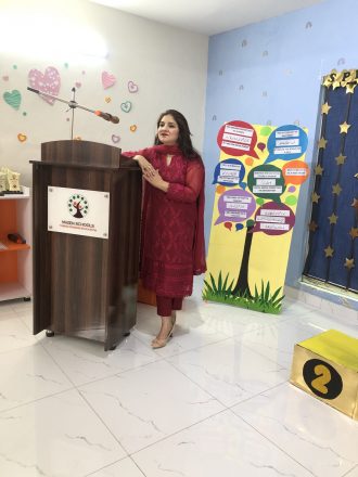 Amina Shabbir, the principal of the Quaid Campus of the Mazen Schools, delivers a speech